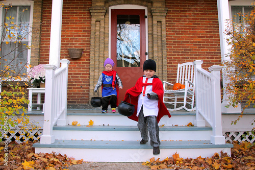 Children in Costumes Trick-or-Treating on Halloween © Christin Lola