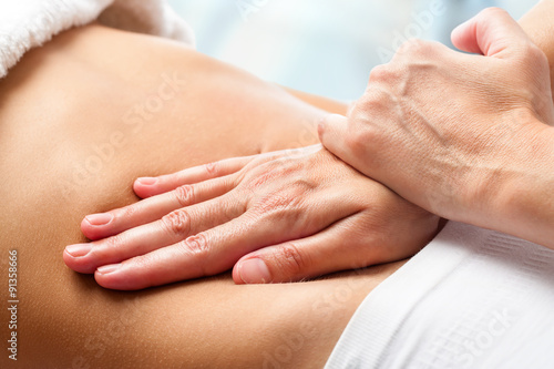 Osteopathic belly massage. photo