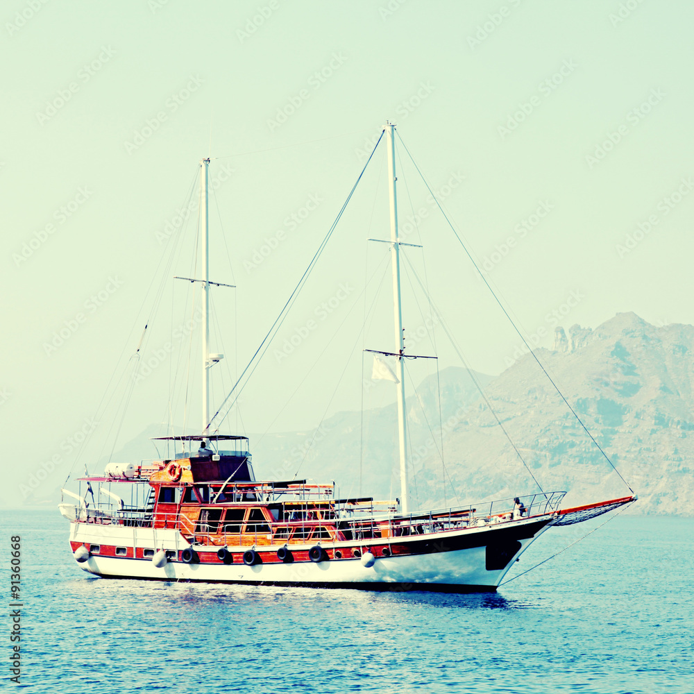 Old classic wooden sailboat in Santorini island, Greece