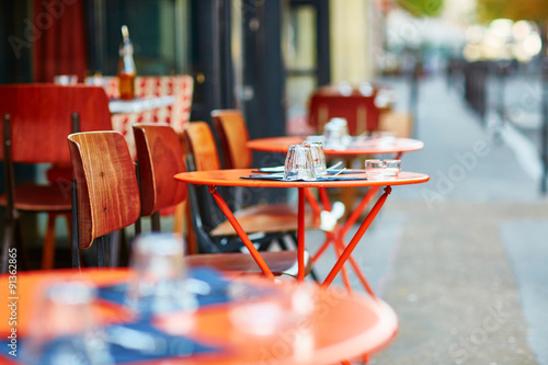 Table of traditional outdoor French cafe in Paris