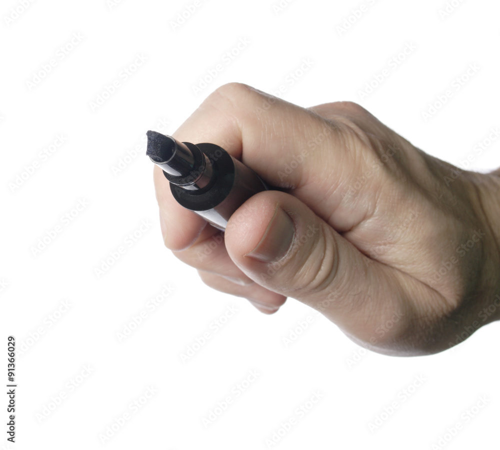 A man's hand holding a black marker. A man's hand holding a black marker.