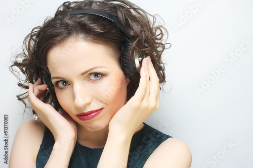  woman with headphones listening to music