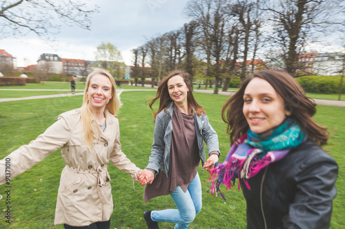 Photography Group of female friends at park in Copenhagen.