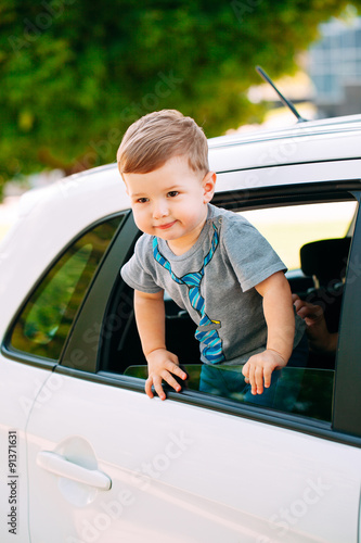 Adorable baby boy in the car