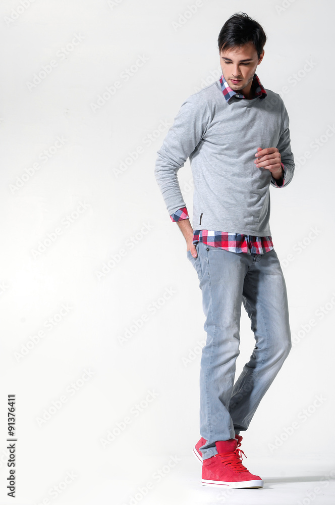 side view of a fashion man walking forward over in studio side view of a fashion man walking forward over in studio
