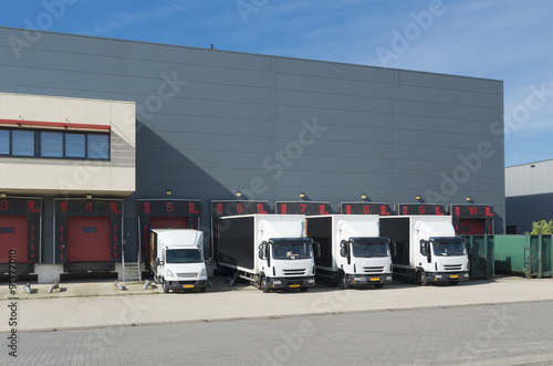 trucks at warehouse building