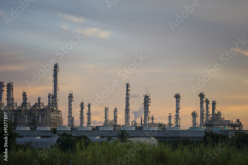 Silhouette of petrochemical plant or Oil and gas refinery in sunrise