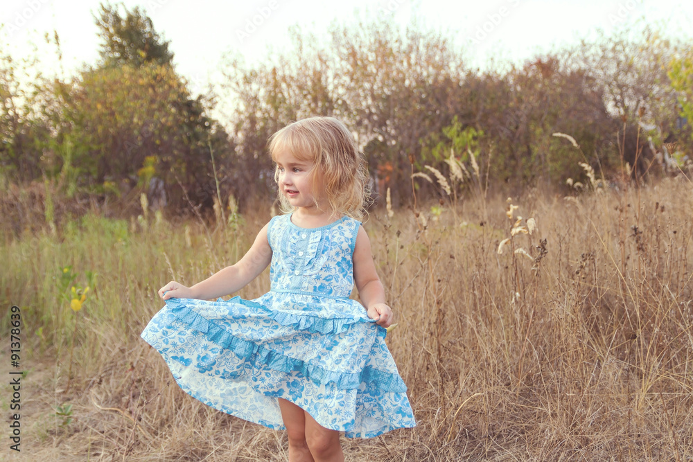 Funny girl dancing on the lawn Funny girl dancing on the lawn
