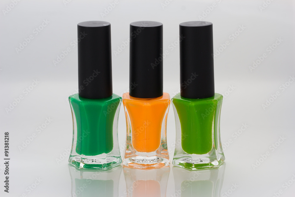 Group of bright nail polishes on white Group of bright nail polishes on white