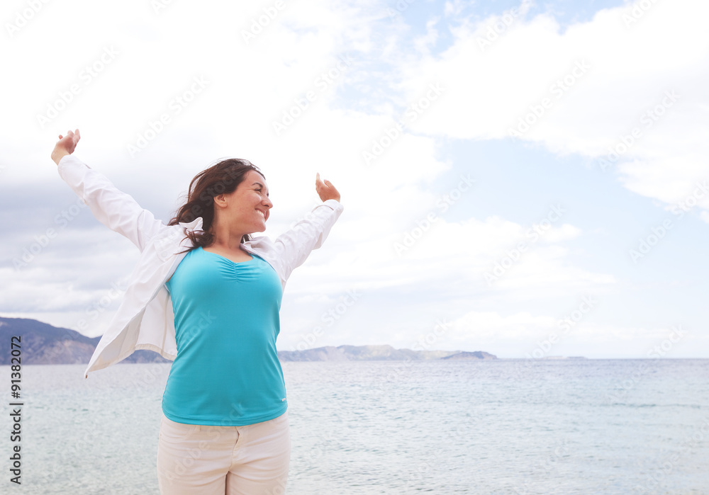 happy girl jumping on the beach