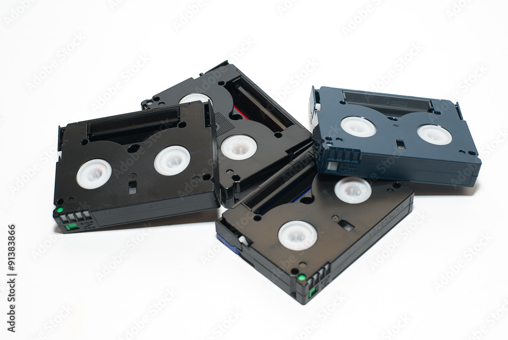 Many video cassettes are on over white Many video cassettes are on over white