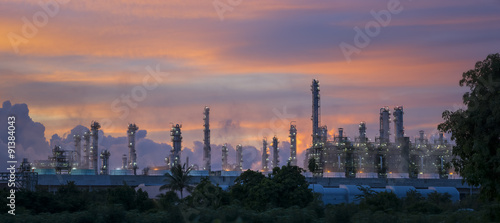 Silhouette of petrochemical plant or Oil and gas refinery in sunrise