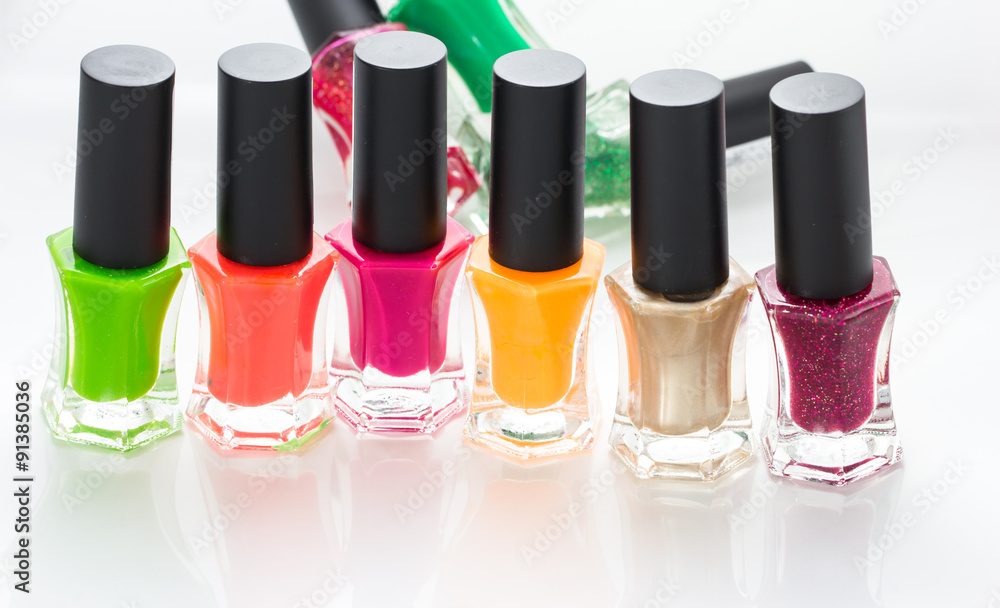 Group of bright nail polishes on white Group of bright nail polishes on white