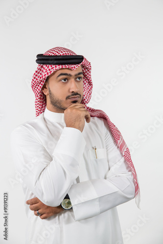 Arab man with hand on chin. photo