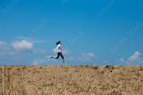 Wide angle of woman running, sport concept, Athlete training on morning.