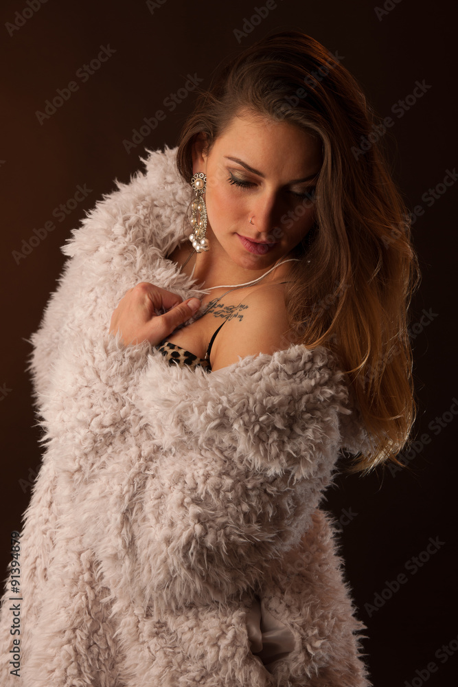Young brunette caucasian woman dancing and her hair flowing through the air Young brunette caucasian woman dancing and her hair flowing through the air