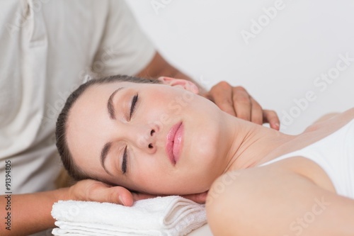 Woman receiving neck massage 