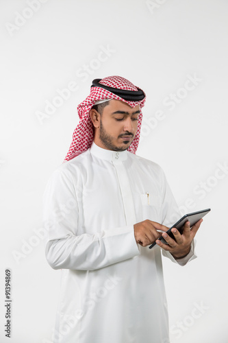 Arab businessman using digital tablet. photo