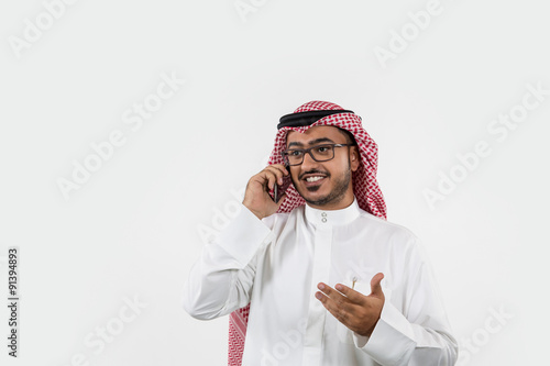 Arab businessman talking on mobile. photo