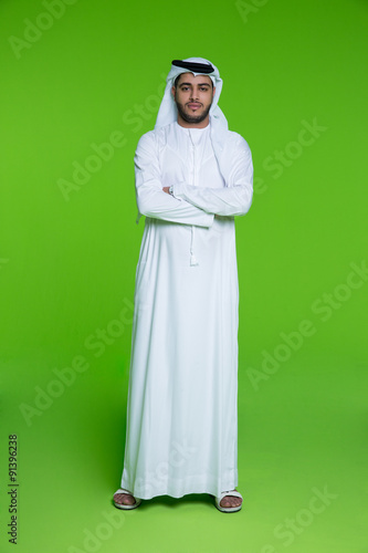 Portrait of Emirati businessman with arms crossed. photo