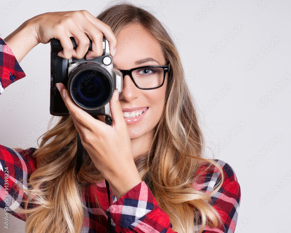 young hipster woman with digital camera smiling young hipster woman with digital camera smiling