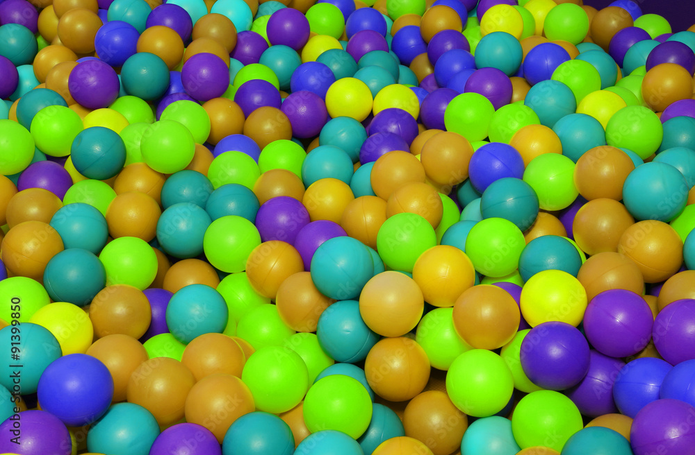 background of many colored plastic balls in a children's pool background of many colored plastic balls in a children's pool