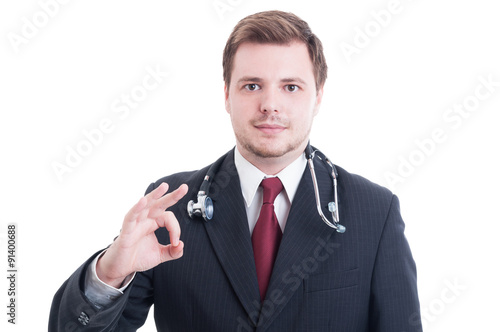 Elegant medic or doctor showing okay perfect gesture