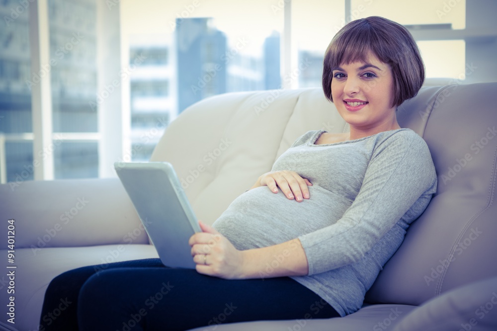 Portrait of pregnant woman using digital tablet Portrait of pregnant woman using digital tablet