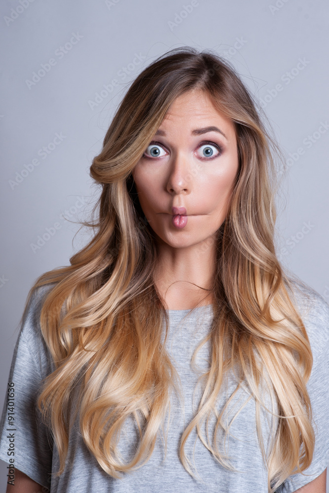 young woman shows off her emotional fear and scream young woman shows off her emotional fear and scream