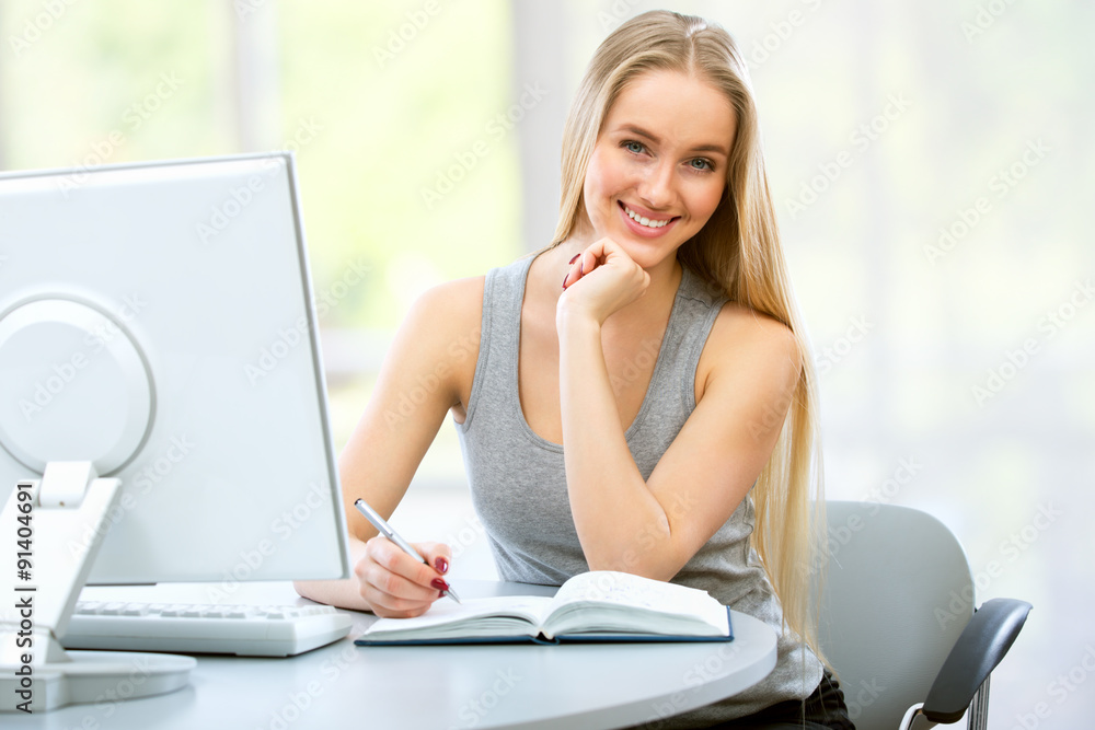 Young woman using computer at home Young woman using computer at home