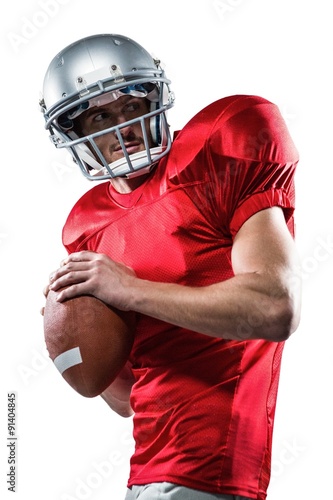 American football player in red jersey throwing the ball