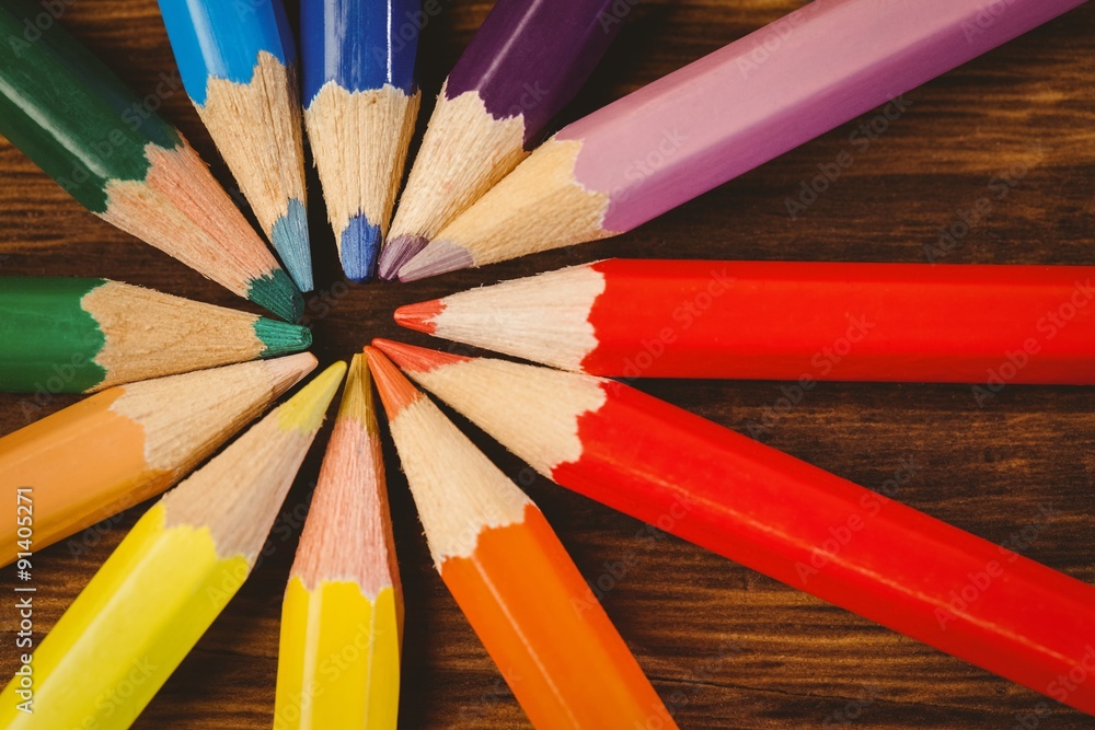 Colour pencils on desk in circle shape Colour pencils on desk in circle shape