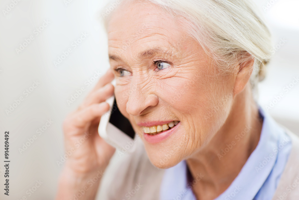senior woman with smartphone calling at home senior woman with smartphone calling at home
