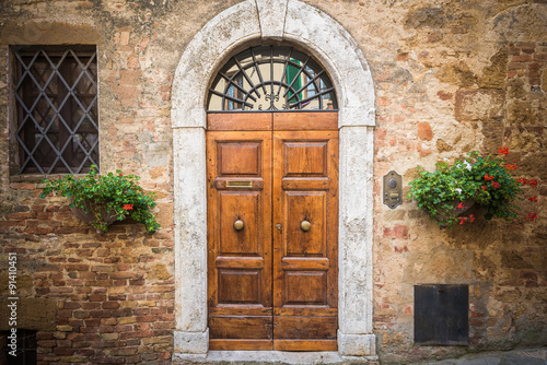 Old destroyed door to the Tuscan home