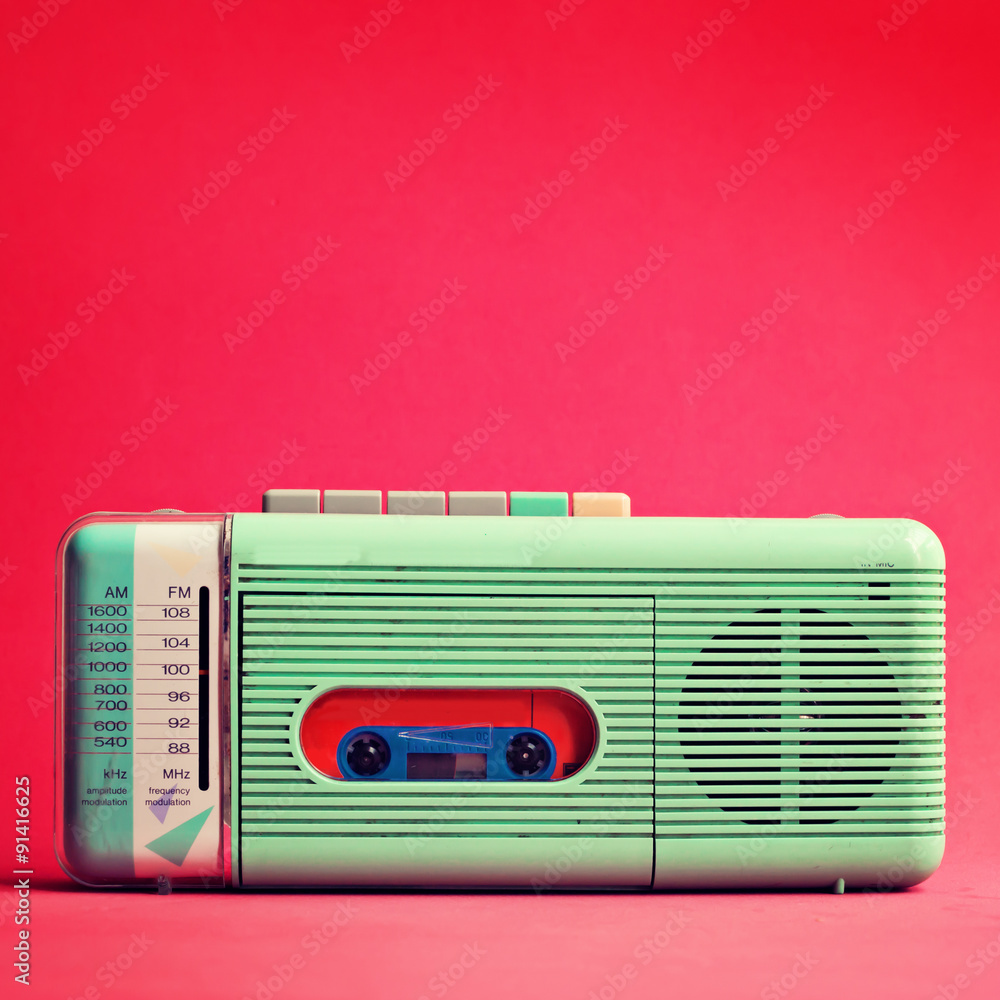 Vintage turquoise radio over red background Stock Photo | Adobe Stock