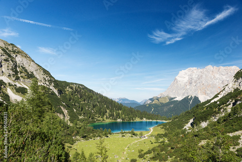 idyllic blue mountain lake in austrian alps with blue sky