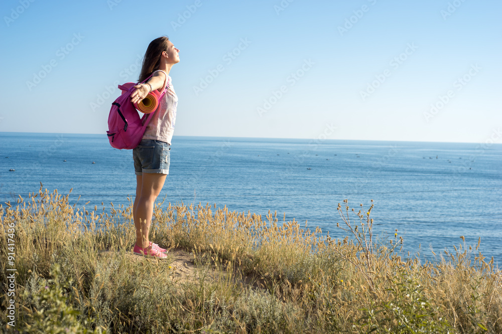 free woman stands on the edge