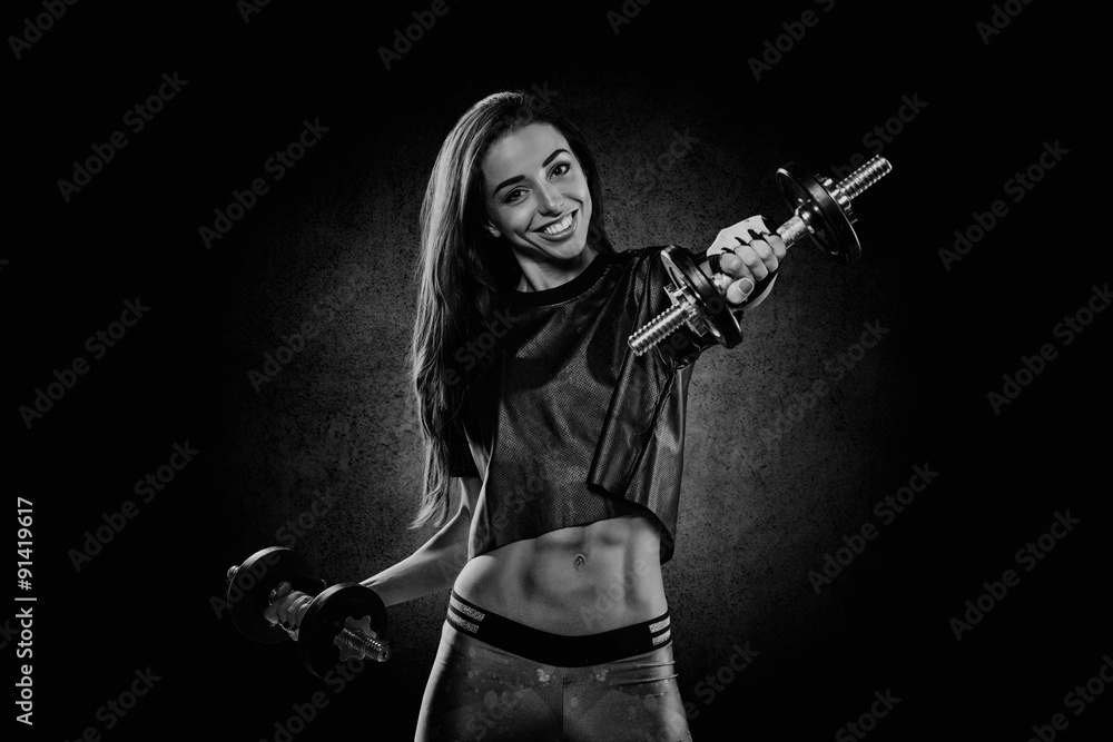 portrait of pretty young girl exercising with weights portrait of pretty young girl exercising with weights