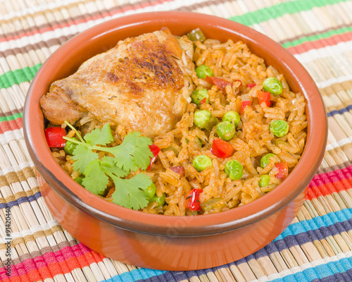 Arroz Con Pollo - Chicken and rice cooked with sofrito and beer.
