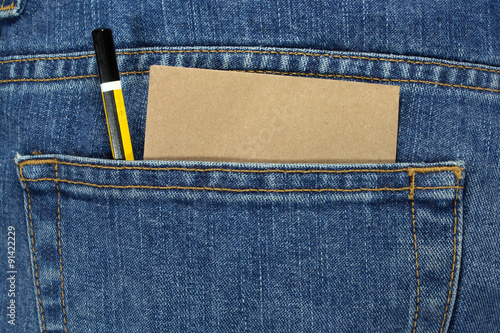 pencil and note paper in a blue jean pocket