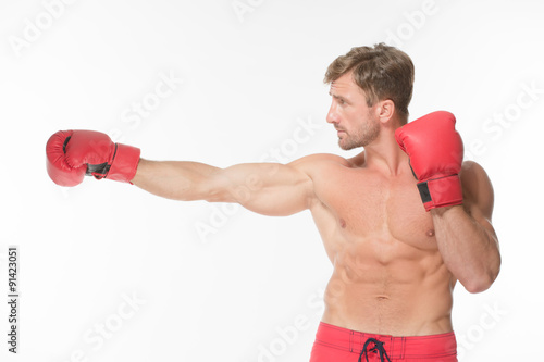 Boxer fighter in red boxing gloves © Svyatoslav Lypynskyy