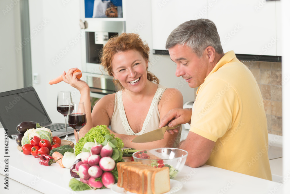 Mature couple in the kitchen Mature couple in the kitchen