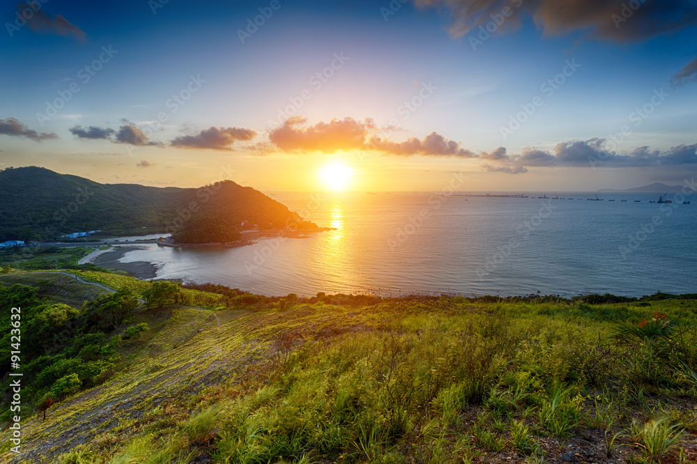 Village with beautiful sunset over hong kong coastline Village with beautiful sunset over hong kong coastline