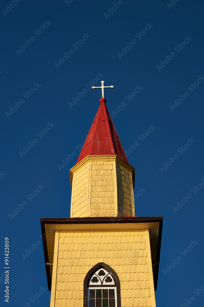 Lutheran Church in Puerto Varas, Chile. Yellow wooden building with red roof. Built circa 1923. Lutheran Church in Puerto Varas, Chile. Yellow wooden building with red roof. Built circa 1923.
