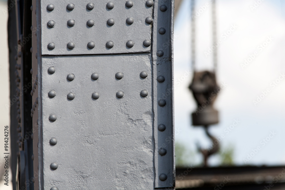 Solid crane steel with rivets and a crane hook Solid crane steel with rivets and a crane hook