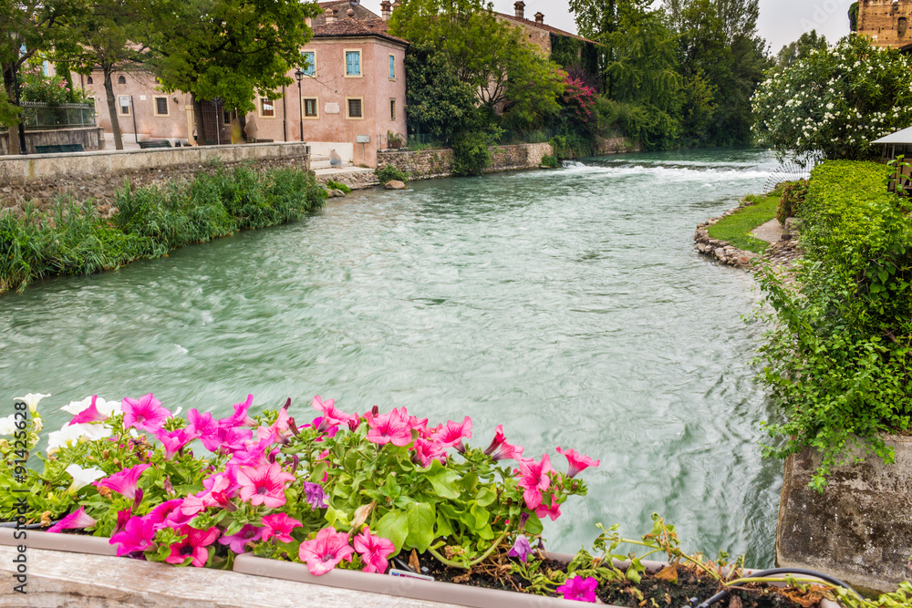 Fototapeta premium Waters and ancient buildings of Italian medieval village
