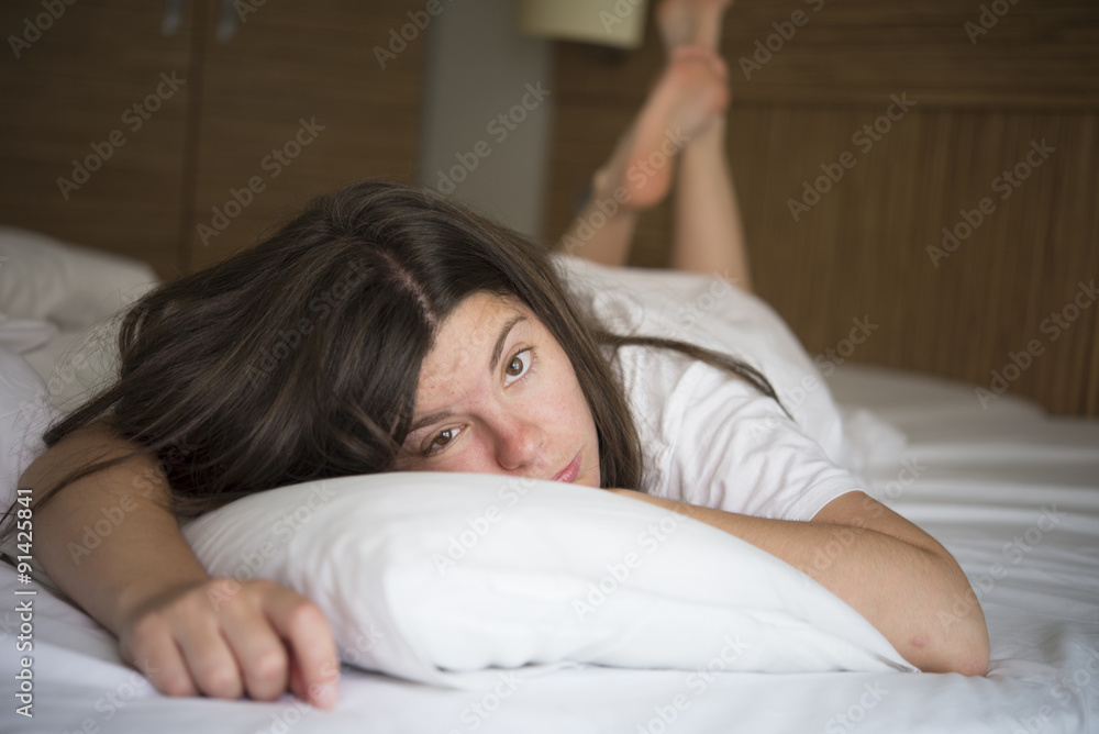 young woman sleeping on the white linen in bed at home, young woman sleeping on the white linen in bed at home,