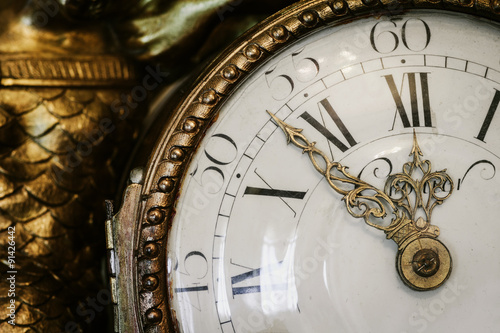 Antique clock with roman numerals