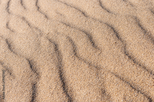 closeup Of sand pattern of a beach in the summer