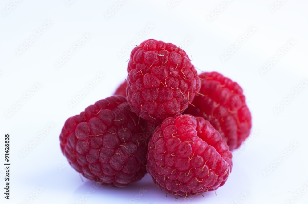 A beautiful selection of freshly picked ripe red raspberries A beautiful selection of freshly picked ripe red raspberries